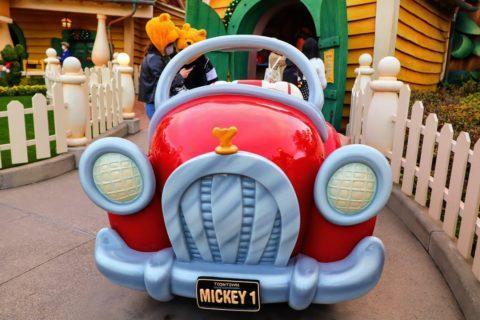 The front side of Mickey's red car in front of Mickey's house and meet mickey