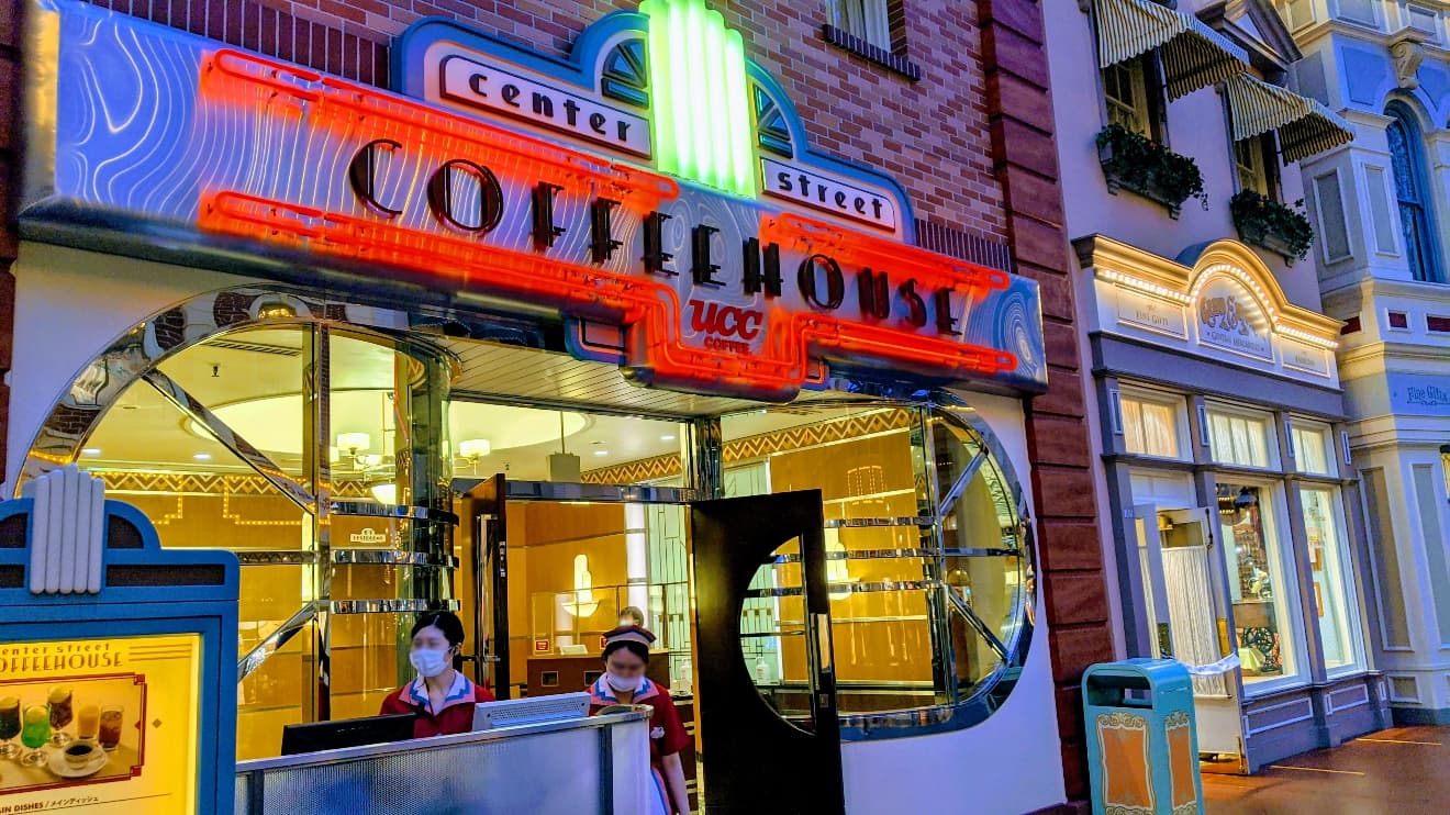 Entrance of Center Street Cofeehouse, glowing neonboard at night