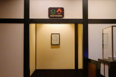 A sign of a samurai in the restroom of Restaurant Hokusai at Tokyo Disneyland