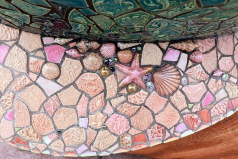 Hidden Mickey on beautifully tiled wall at mermaid lagoon